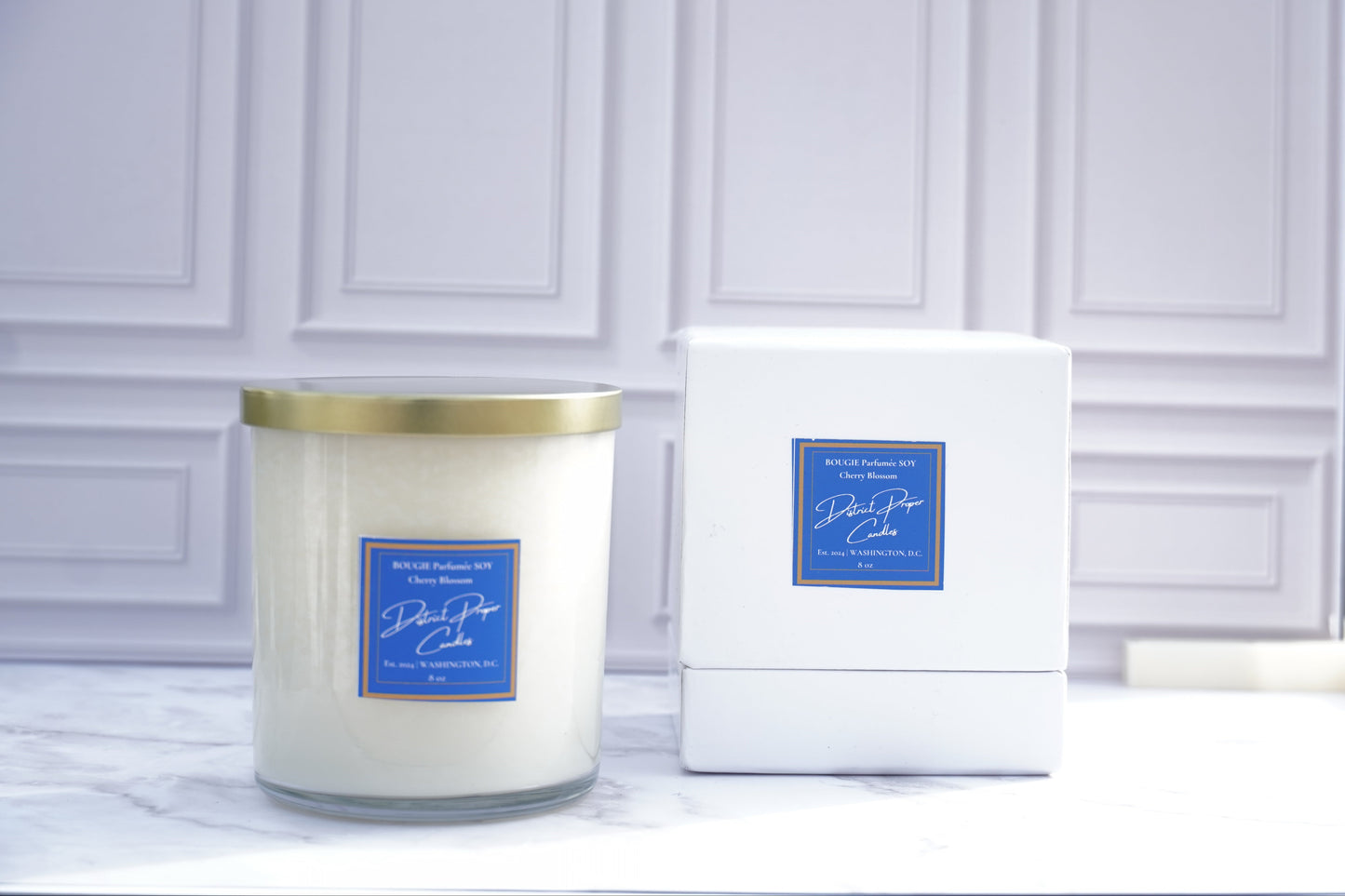 White candle with clear jar. Cherry Blossom Candle handpoured in soy wax. Smells like vanilla, lavender and a hint of cherry.