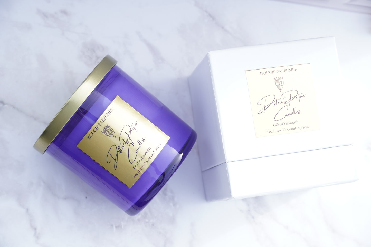 Purple candle handpoured in coconut apricot wax. Smells like driftwood and cashmere. Luxury design and packaging included.