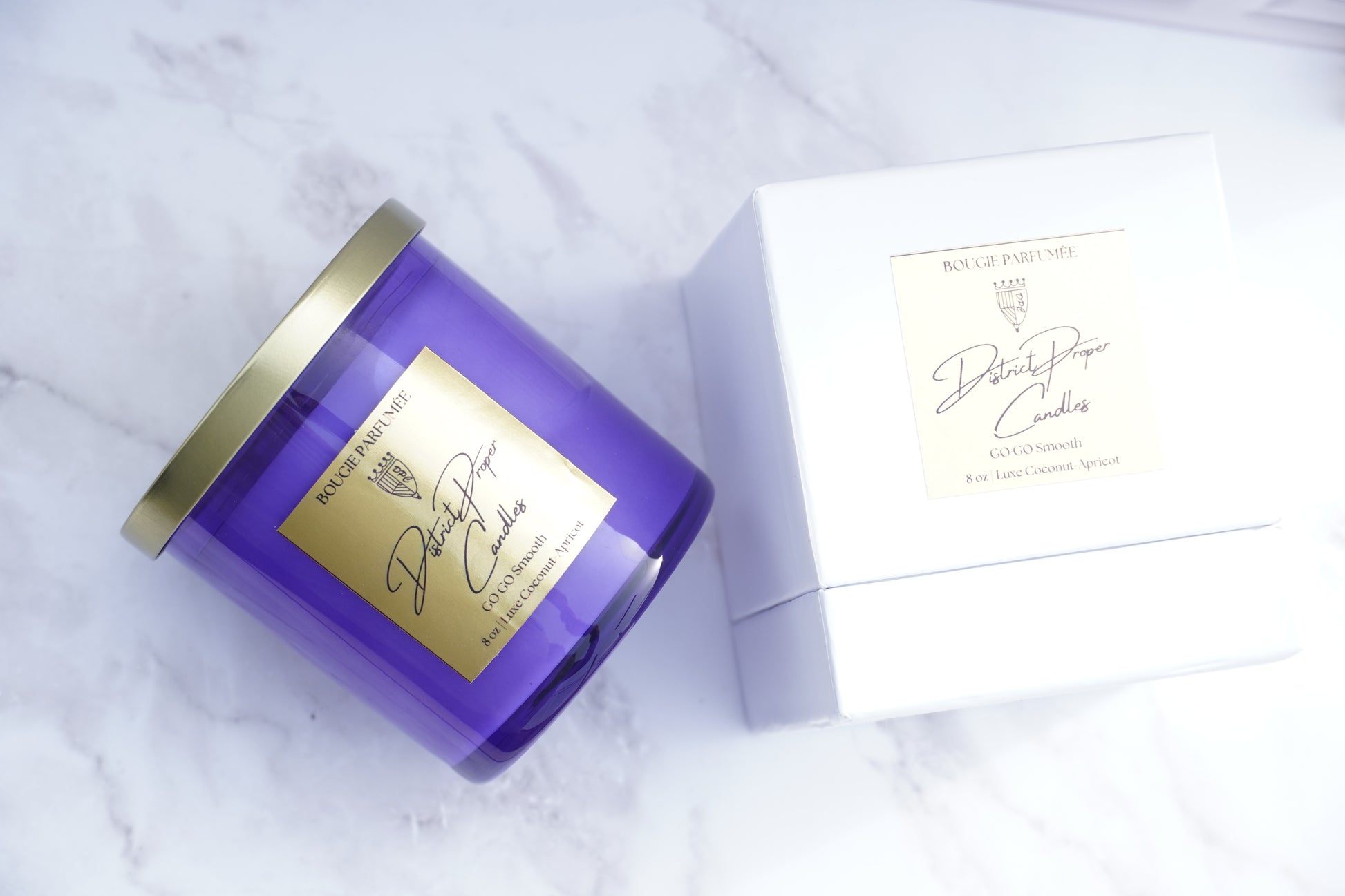 Purple candle handpoured in coconut apricot wax. Smells like driftwood and cashmere. Luxury design and packaging included.